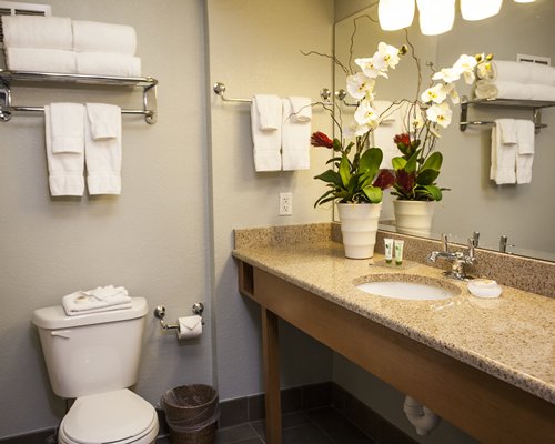 A bathroom with single sink vanity.
