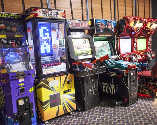 An indoor recreation room with arcade games.