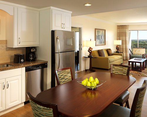 A well furnished living room with television and bedroom.