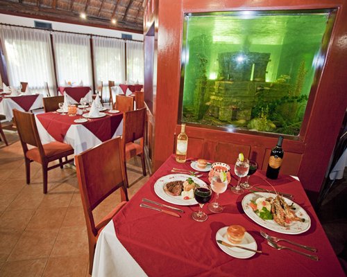 An indoor fine dining restaurant with an outside view.