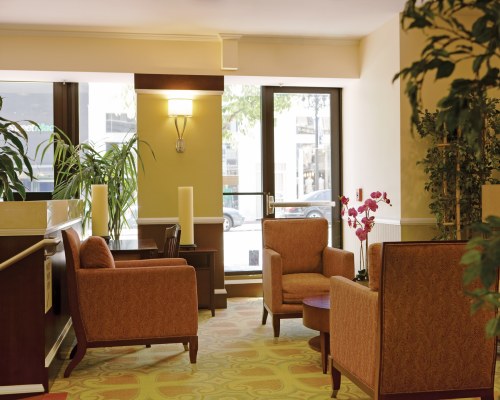 AN INDOOR LOUNGE AREA AT THE RESORT WITH AN OUTSIDE VIEW.
