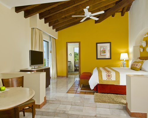 Bedroom with Ornate footrest at Casa Velas Boutique Hotel-All Inclusive