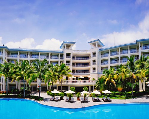 Exterior view of the resort with an extravagant outdoor swimming pool.