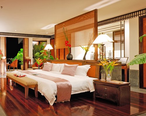 A well furnished bedroom with balcony.
