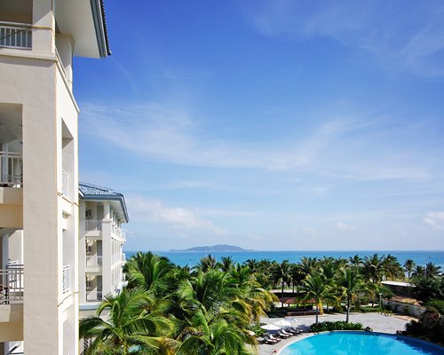 Balcony view of the resort and outdoor swimming pool.