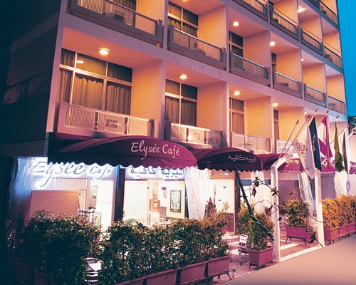 Scenic exterior view of Elysee Residence Suites with multiple balconies.