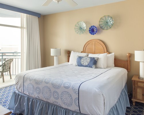 A well furnished bedroom with a queen bed.