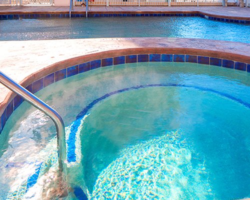 Outdoor swimming pool and hot tub.