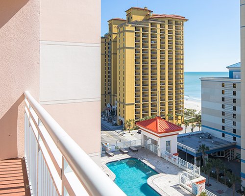 Balcony view of the resort with outdoor swimming pool.