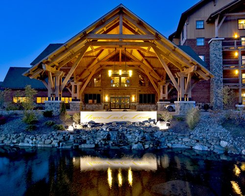 An exterior view of the Hope Lake Lodge Resort and Indoor Waterpark At Greek Peak with the waterfront.