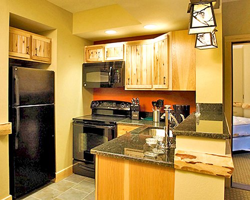 A well equipped kitchen with a microwave oven.