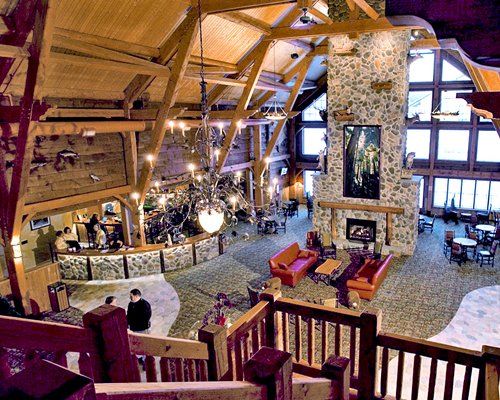 View of the reception and lounge area from an indoor balcony.