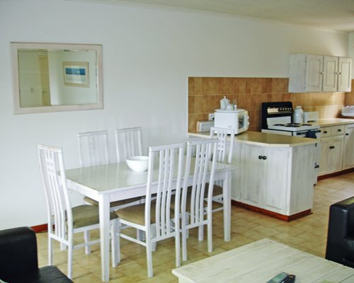 An open plan dining and kitchen area.