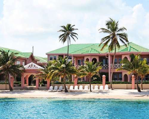 Exterior view of Grand Colony Island Villa alongside the waterfront.