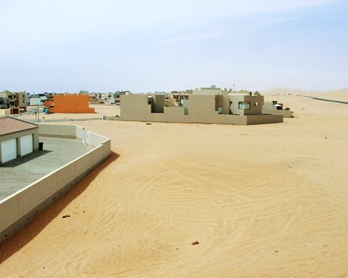 A view of the resort property alongside a desert.