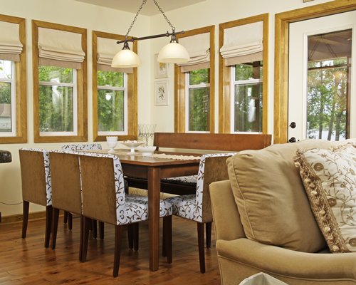A well furnished living and dining area with an outside view.
