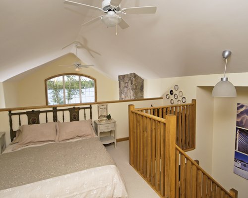 Interior view of the wooden stairway to a bedroom.