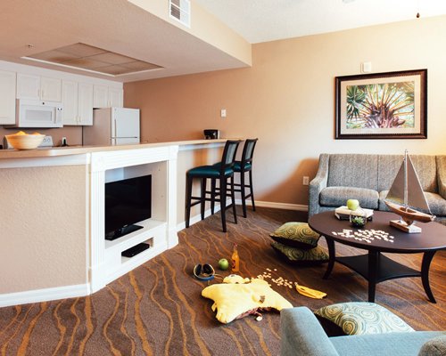 A well furnished living room with double pull out sofa and an outside view.