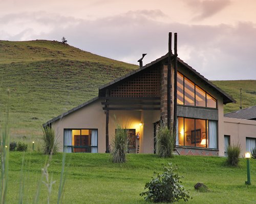 An exterior view of resort unit alongside the mountain.