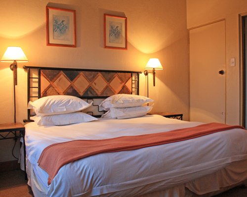 A well furnished bedroom with a double bed.
