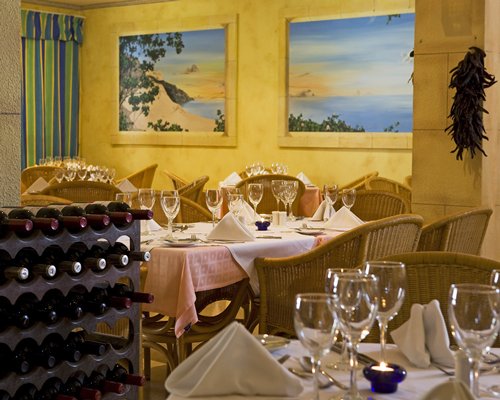 A view of indoor fine dining restaurant with wine rack.