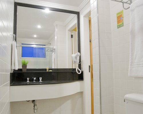 A bathroom with single sink vanity.