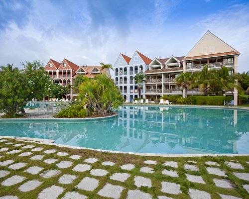 A large outdoor swimming pool alongside the resort.
