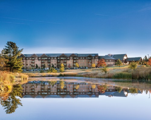 AN EXTERIOR VIEW OF THE RESORT WITH THE WATERFRONT.