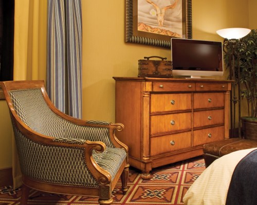 A WELL FURNISHED INDOOR ROOM WITH A TELEVISION.