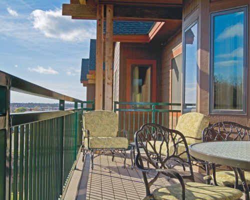 A VIEW OF PATIO FURNITURE IN THE BALCONY.