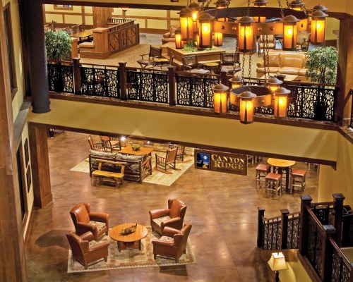 AN INTERIOR BALCONY VIEW OF THE LOUNGE AREA AT THE RESORT.