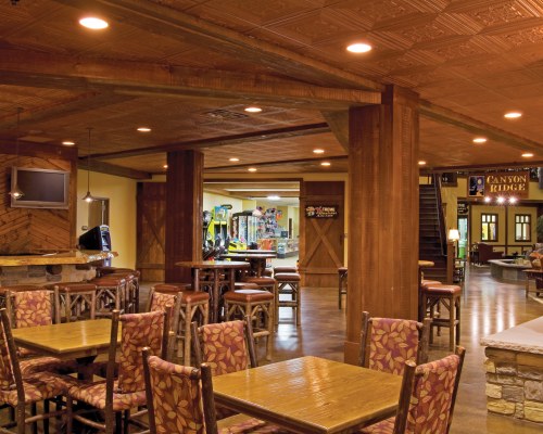 AN INDOOR FINE DINING RESTAURANT WITH A TELEVISION.