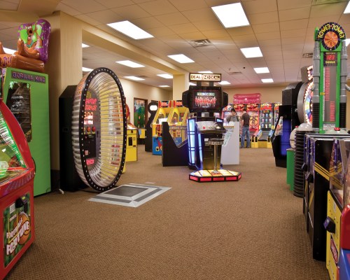 AN INDOOR RECREATIONAL AREA WITH AN ARCADE.