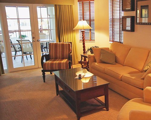 A well furnished living room with queen pull out sofa and patio.