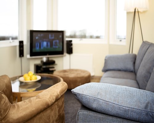A well furnished living room with a television.