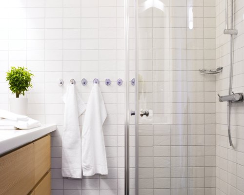 A bathroom with a stand up shower.
