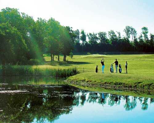 View of well maintained golf course alongside the waterfront.