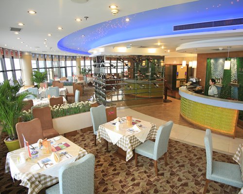 An indoor restaurant with a reception at FVC @ Jinma International Hotel Hangzhou.