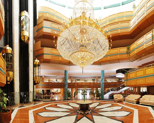An interior view of multi story resort units with chandelier.