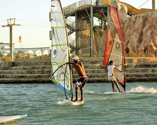 A view of two people windsurfing.
