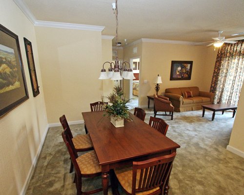 A well furnished living room with dining area.