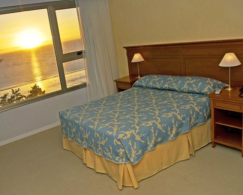Bedroom with view of sunset.