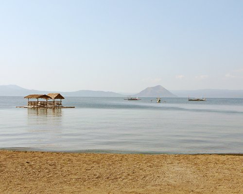 Beach view of boats in the bay .