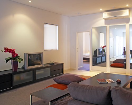 A well furnished living room with a television.