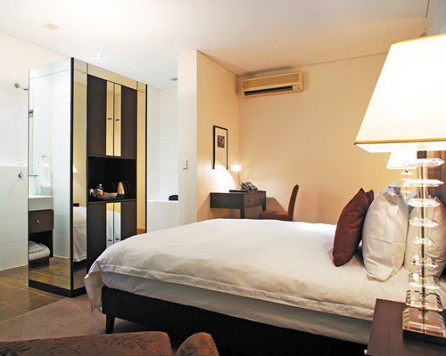 A well furnished bedroom with a king bed.