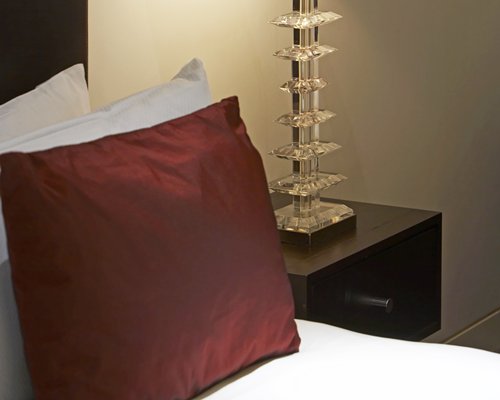 Close up view of a bedside lamp.