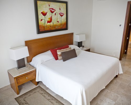A well furnished living room with a television dining area and the ocean view.