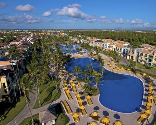 An aerial view of Ocean Blue & Sand with an outdoor swimming pool.
