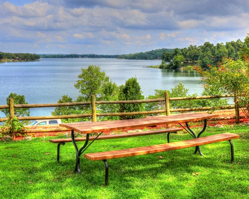 An outdoor picnic area alongside the lake.