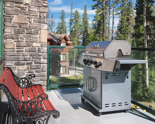 An outdoor barbecue grills in the patio.